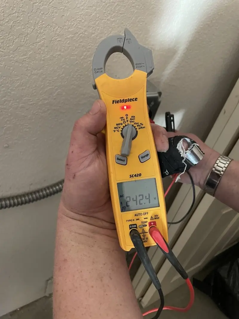 Voltage testing with clamp meter during Outlet Installation in Dormont